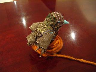 Bird made from old suit material